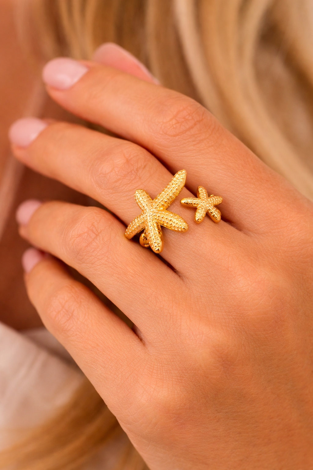 Gold double starfish open ring worn on hand, stainless steel coastal-inspired women’s jewelry
